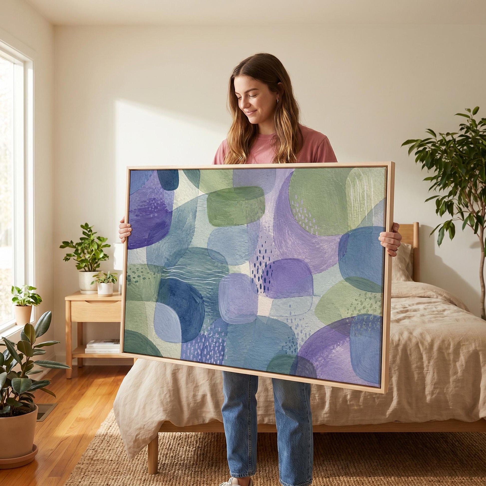 Soft muted shapes in dusty plum and sage, canvas wall art hanging in a calm, modern living space