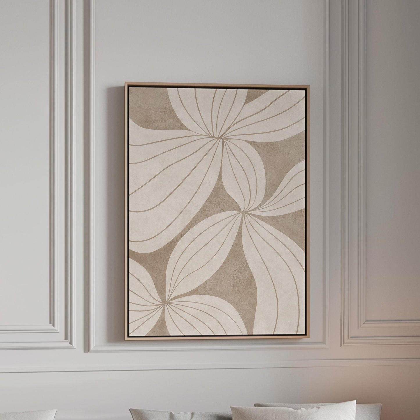 Abstract line drawing of oversized petals in cream and sand beige, canvas print in a bright room with natural daylight