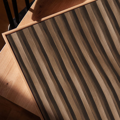 Vertical wavy stripes in dark walnut and coffee brown tones, canvas print in a warm, minimally styled interior