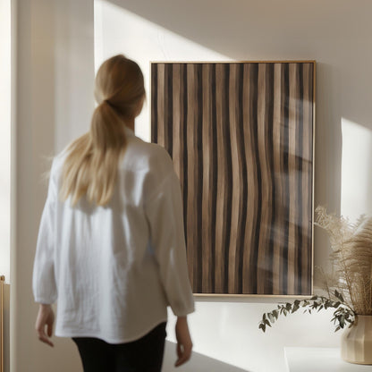 Vertical wavy stripes in dark walnut and coffee brown tones, canvas print hanging in a calm, modern living space