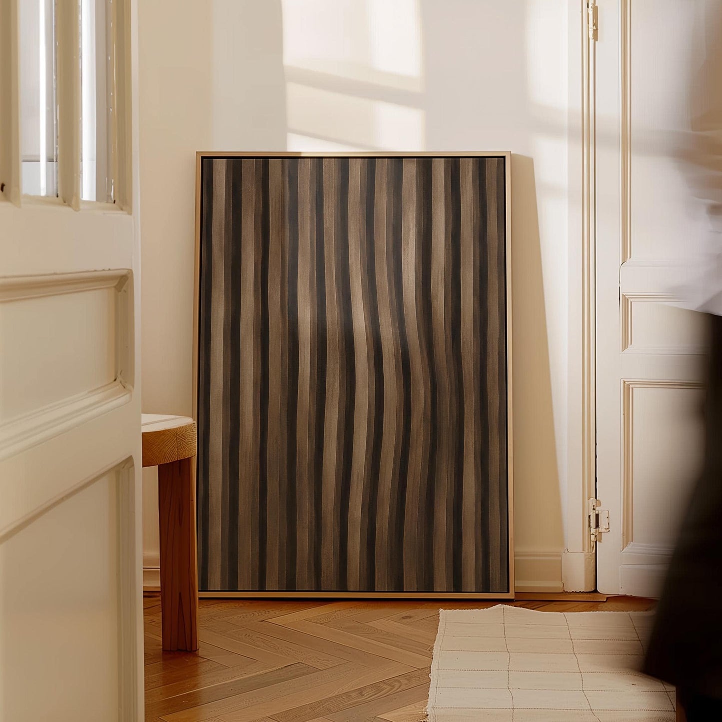 Vertical wavy stripes in dark walnut and coffee brown tones, canvas print styled against a soft white wall