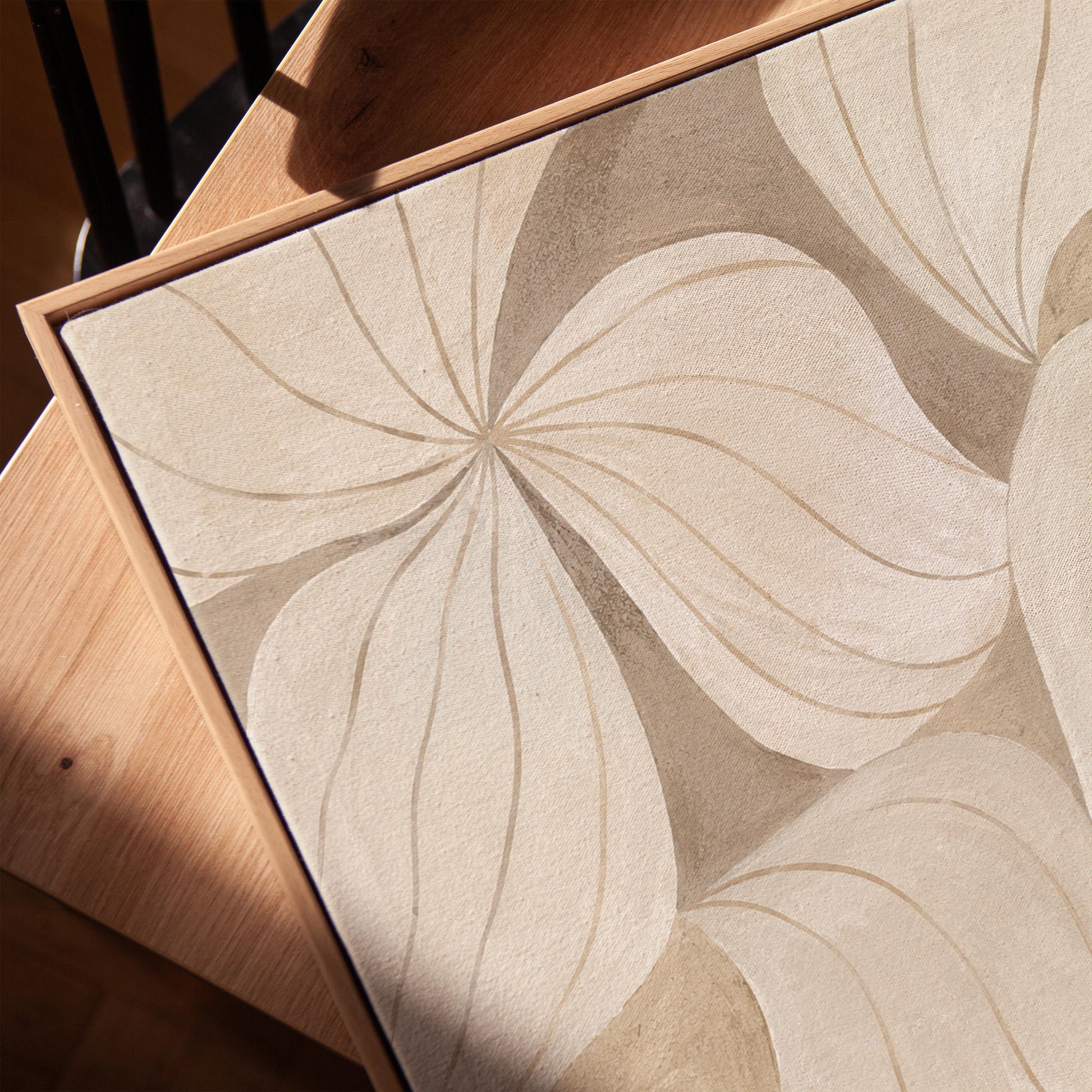 Soft cream petals drawn with thin outlines filling the frame, canvas print in a warm, minimally styled interior