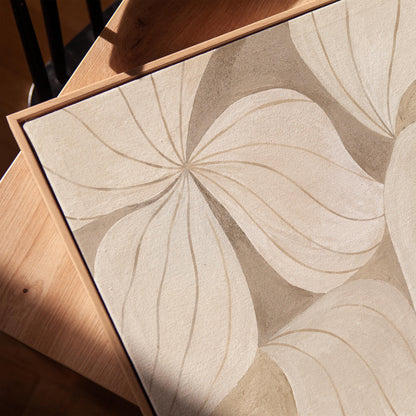 Soft cream petals drawn with thin outlines filling the frame, canvas print in a warm, minimally styled interior