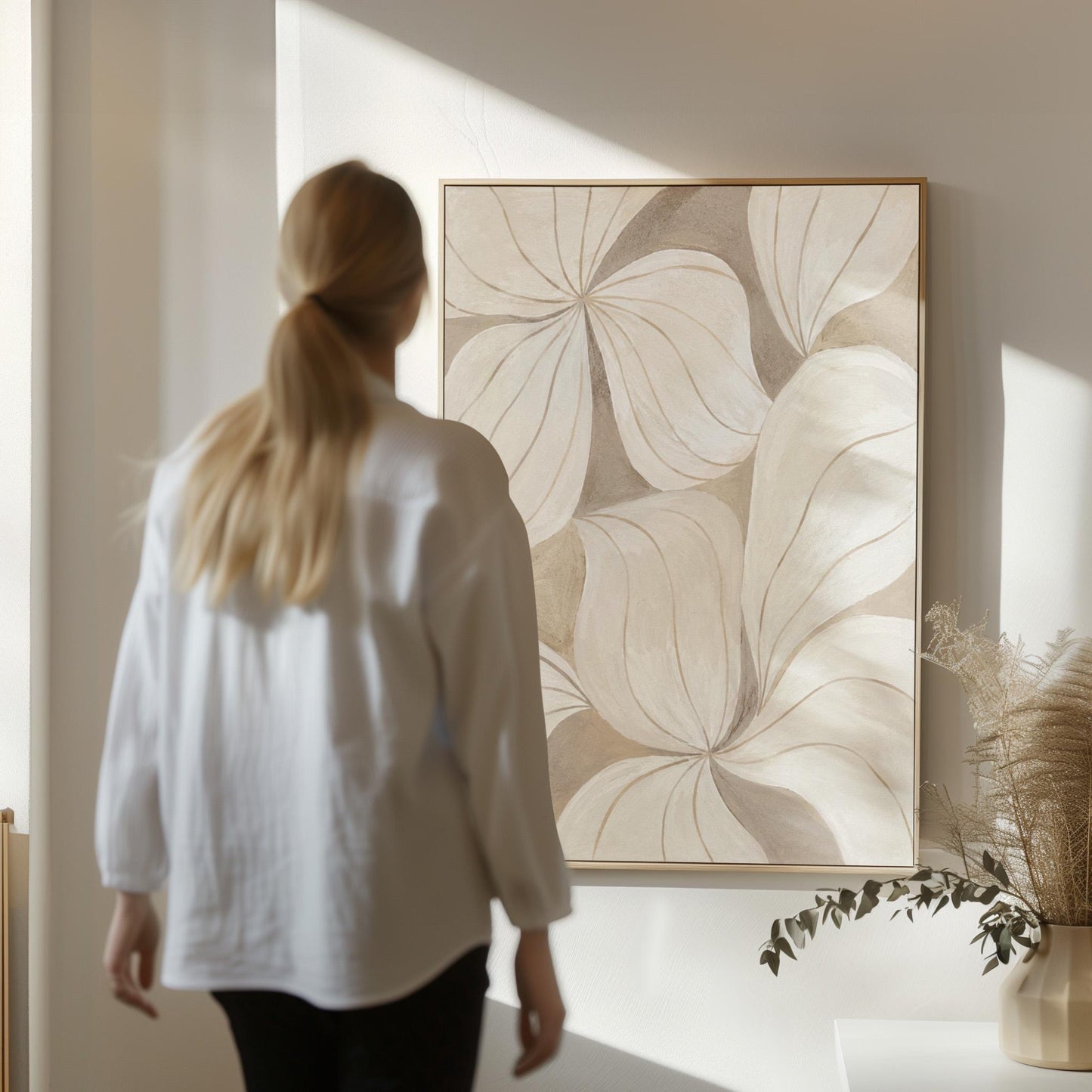 Soft cream petals drawn with thin outlines filling the frame, canvas print presented in a light, minimal room