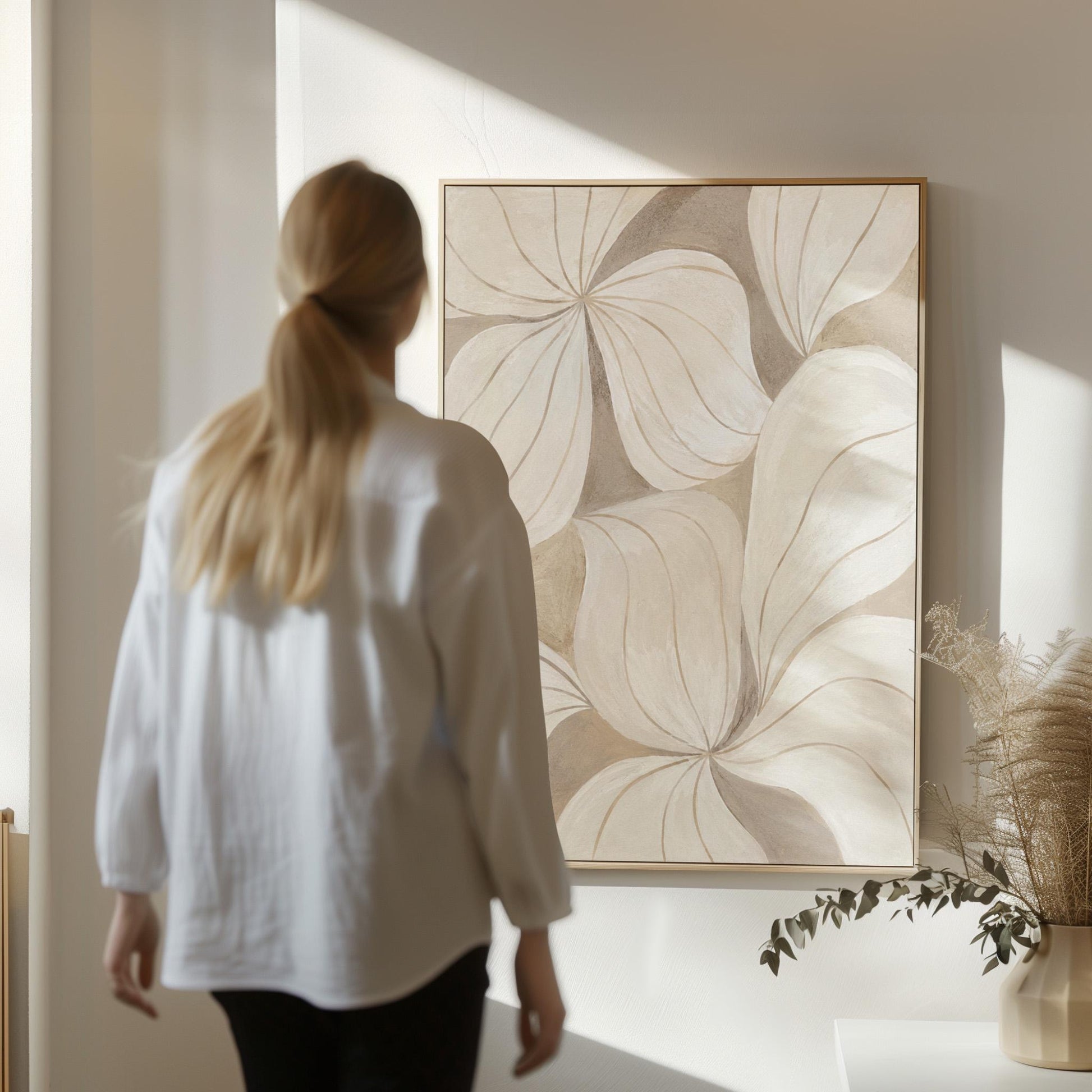 Soft cream petals drawn with thin outlines filling the frame, canvas print presented in a light, minimal room