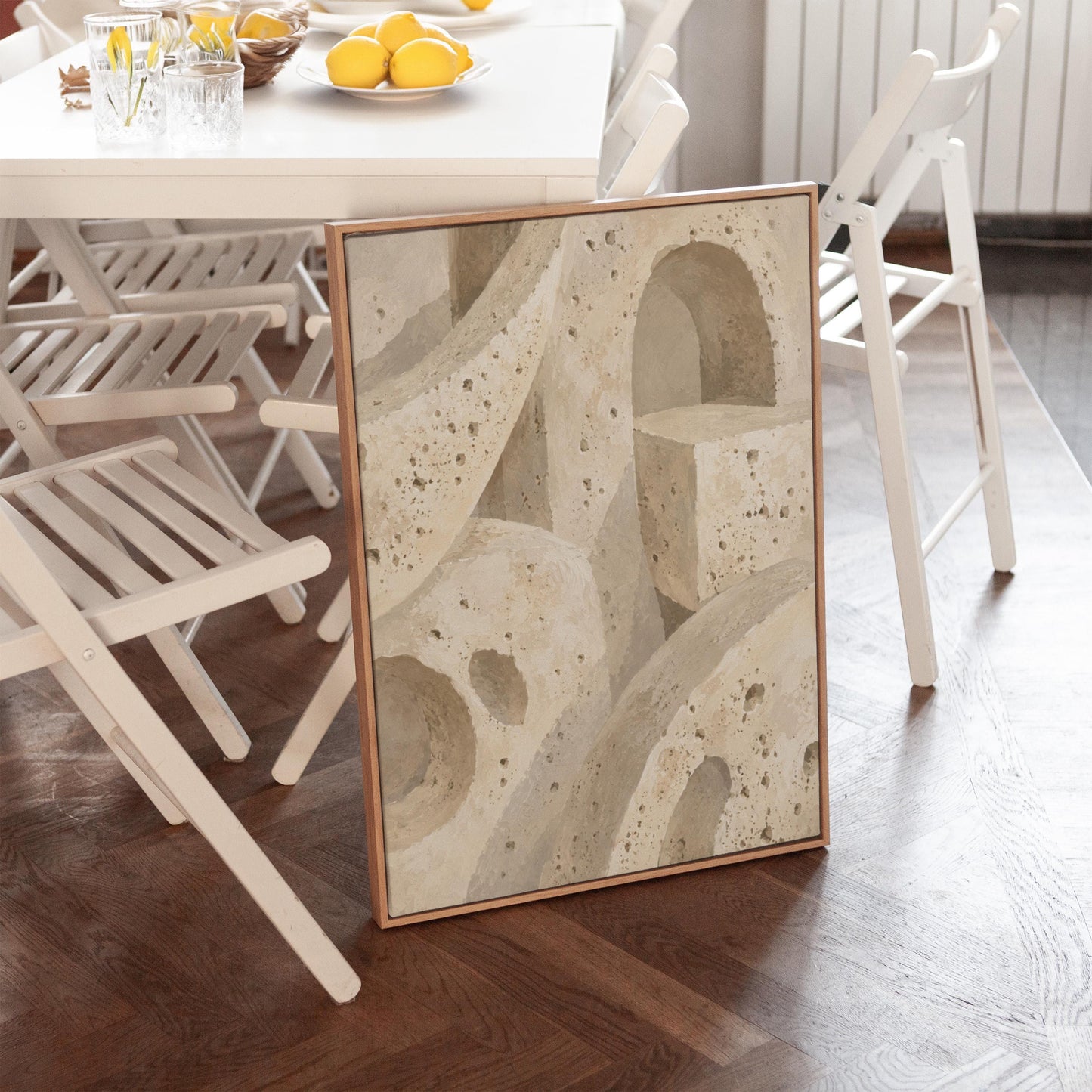 Interlocking arches and organic forms in warm speckled beige, canvas print displayed on a neutral wall in a styled interior