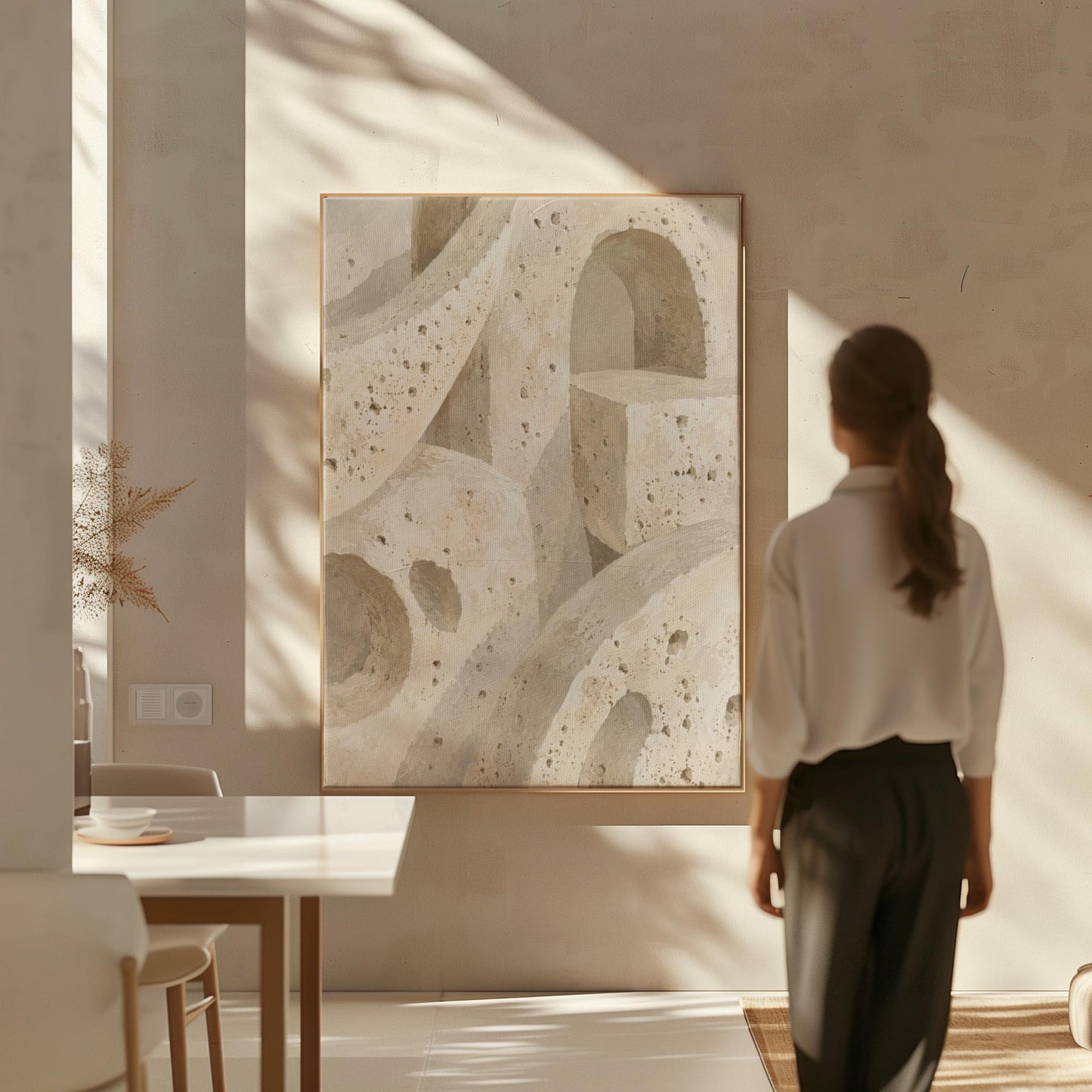 Interlocking arches and organic forms in warm speckled beige, canvas print seen in a warm interior with natural light