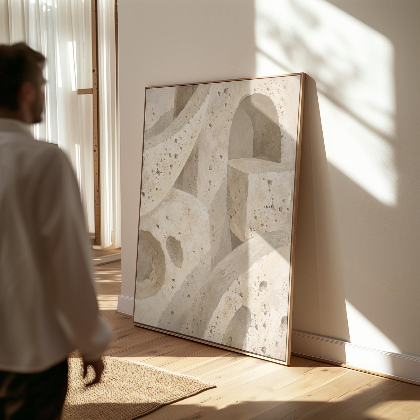 Interlocking arches and organic forms in warm speckled beige, canvas wall art on a quiet wall in a considered interior