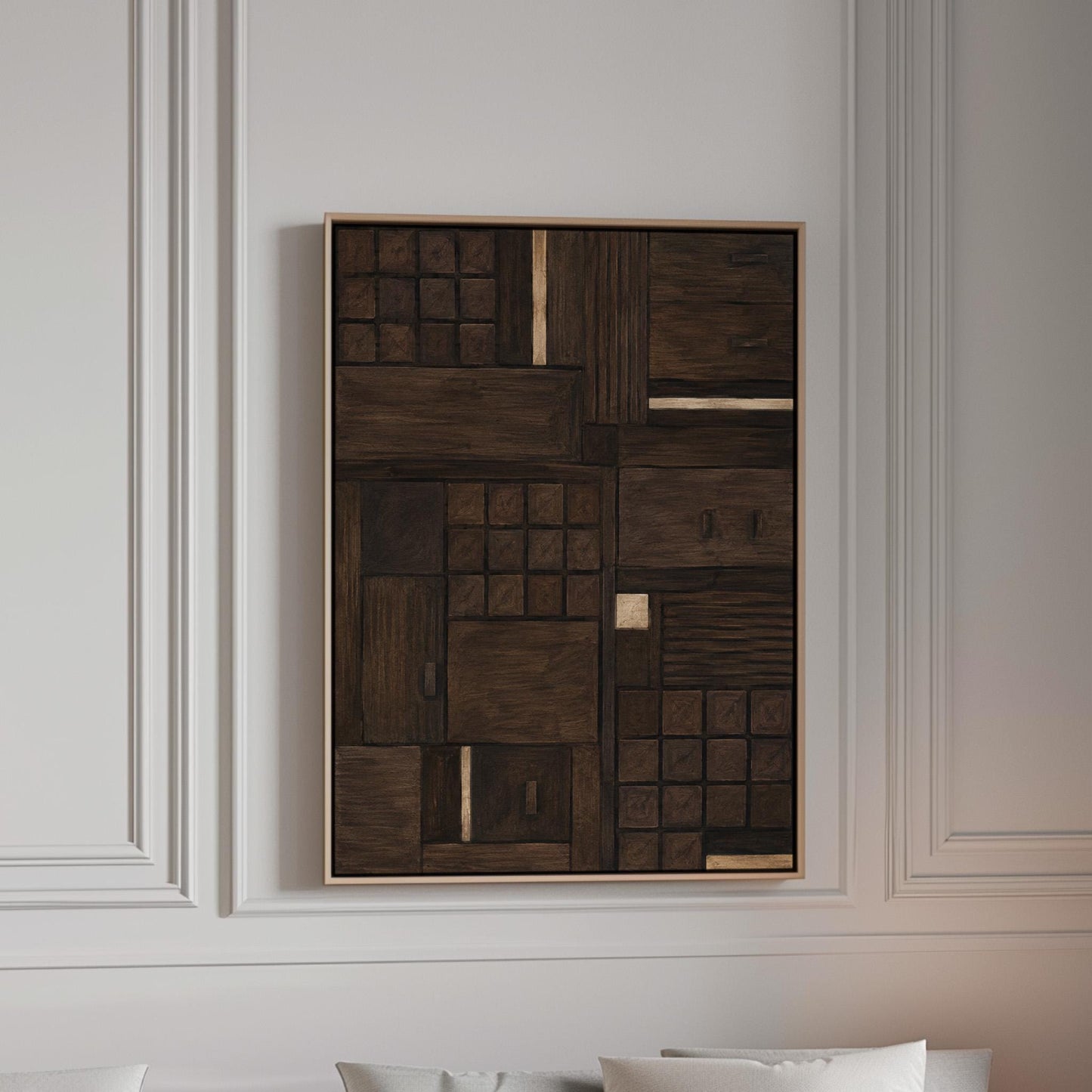 Dark espresso brown geometric patchwork with small gold accents, canvas print in a bright room with natural daylight