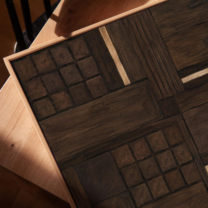 Dark espresso brown geometric patchwork with small gold accents, canvas print in a warm, minimally styled interior