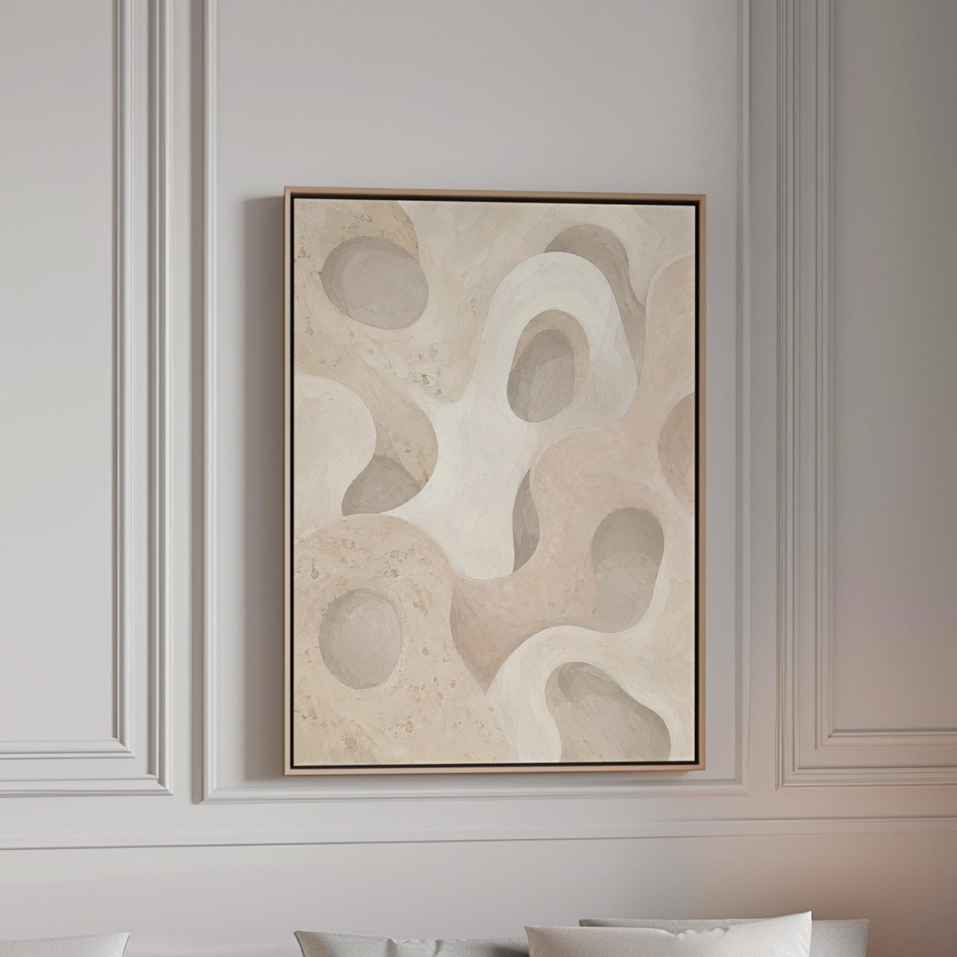Soft organic flowing shapes in cream and light beige, canvas print in a bright room with natural daylight