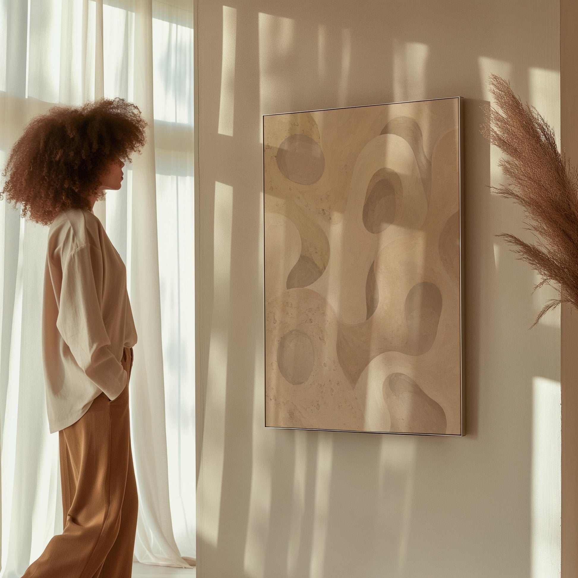 Soft organic flowing shapes in cream and light beige, canvas print shown in a sunlit, contemporary room