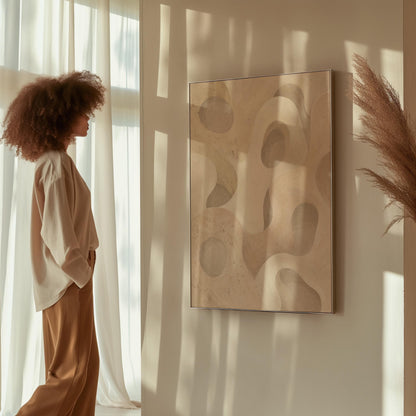 Soft organic flowing shapes in cream and light beige, canvas print shown in a sunlit, contemporary room