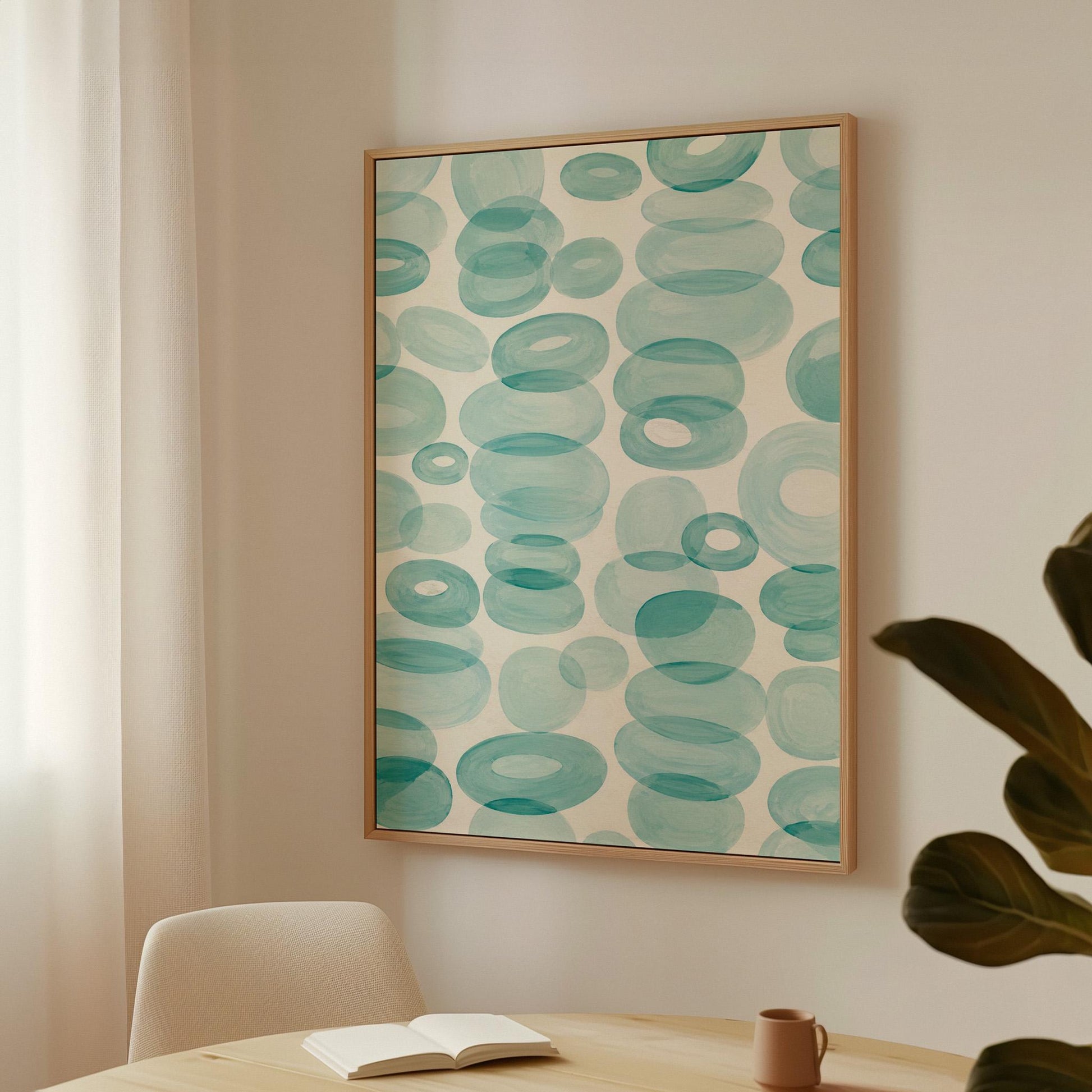 Watercolor rings and ovals in aqua and teal like sea glass, canvas print on a quiet wall in a considered interior