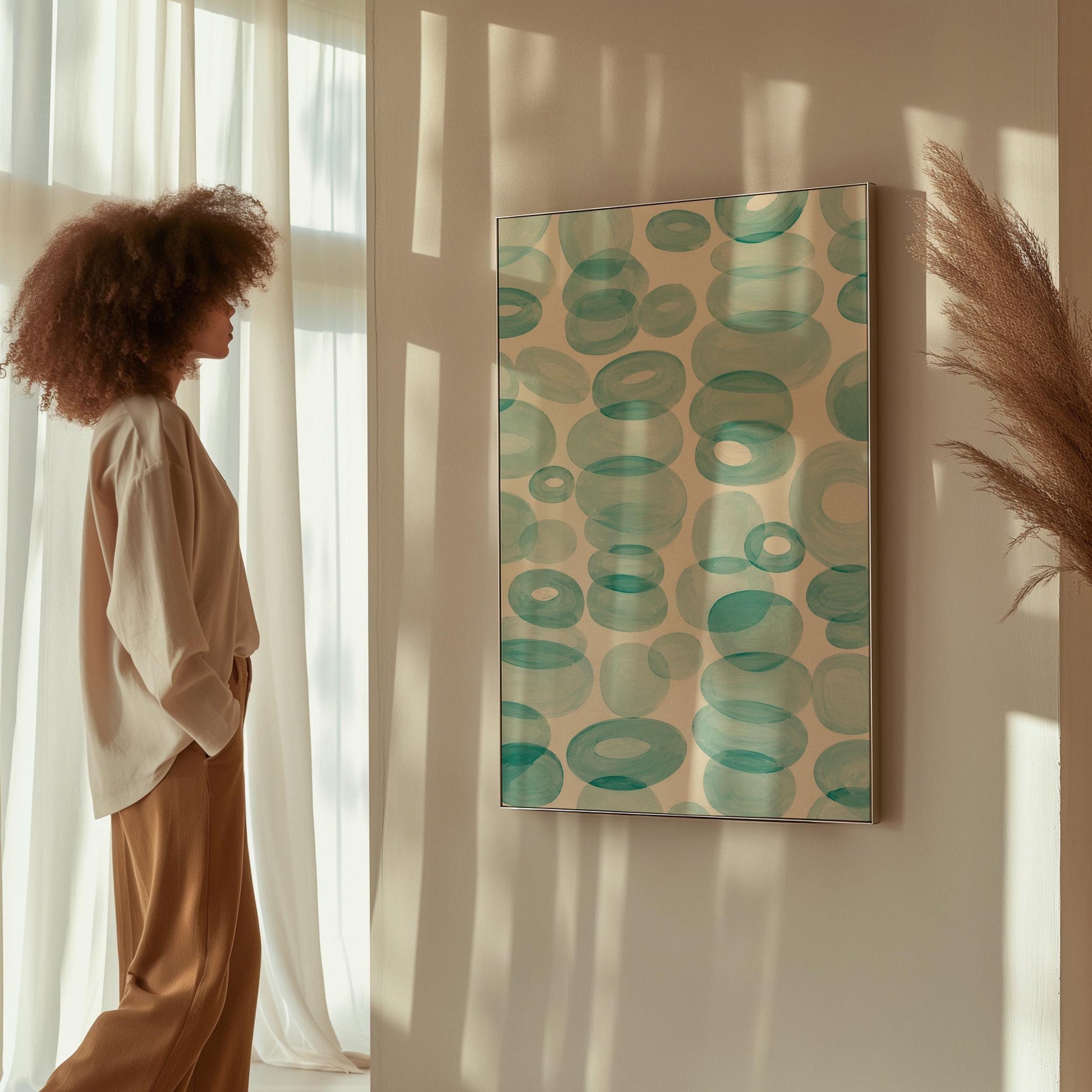 Watercolor rings and ovals in aqua and teal like sea glass, canvas print shown to scale in a furnished room