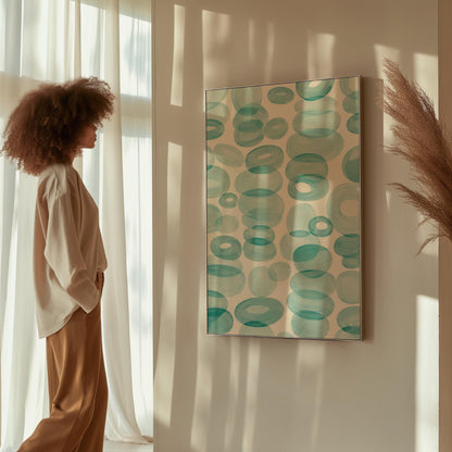 Watercolor rings and ovals in aqua and teal like sea glass, canvas print shown to scale in a furnished room