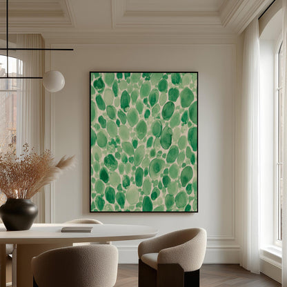 Dense watercolor pebble shapes in mint to emerald green, canvas wall art hanging in a calm, modern living space