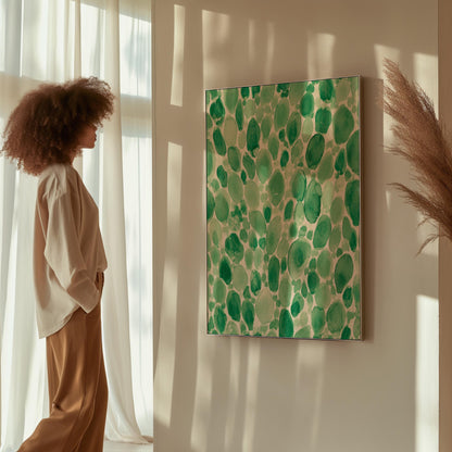 Dense watercolor pebble shapes in mint to emerald green, canvas wall art styled against a soft white wall