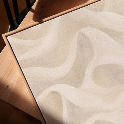 Flowing silky wave shapes in ivory and warm white, canvas print in a warm, minimally styled interior