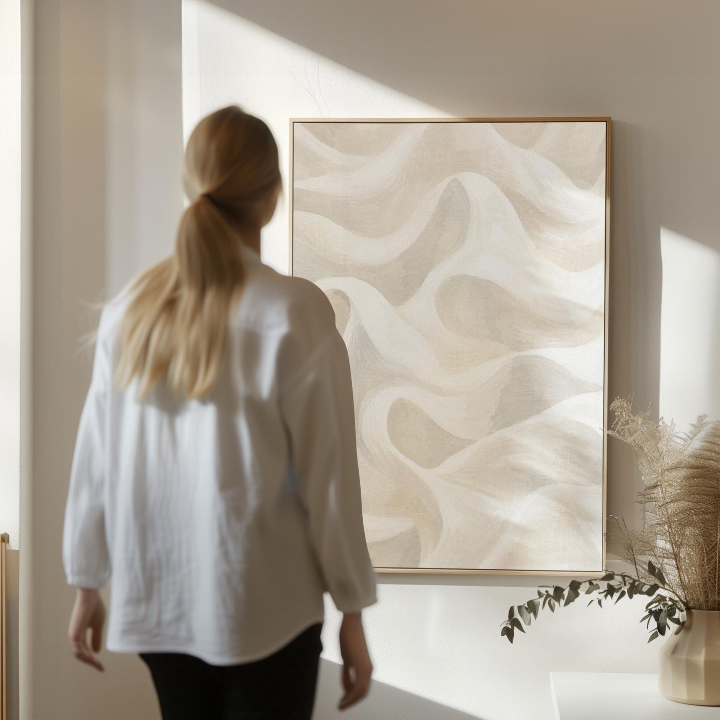 Flowing silky wave shapes in ivory and warm white, canvas print shown in a sunlit, contemporary room