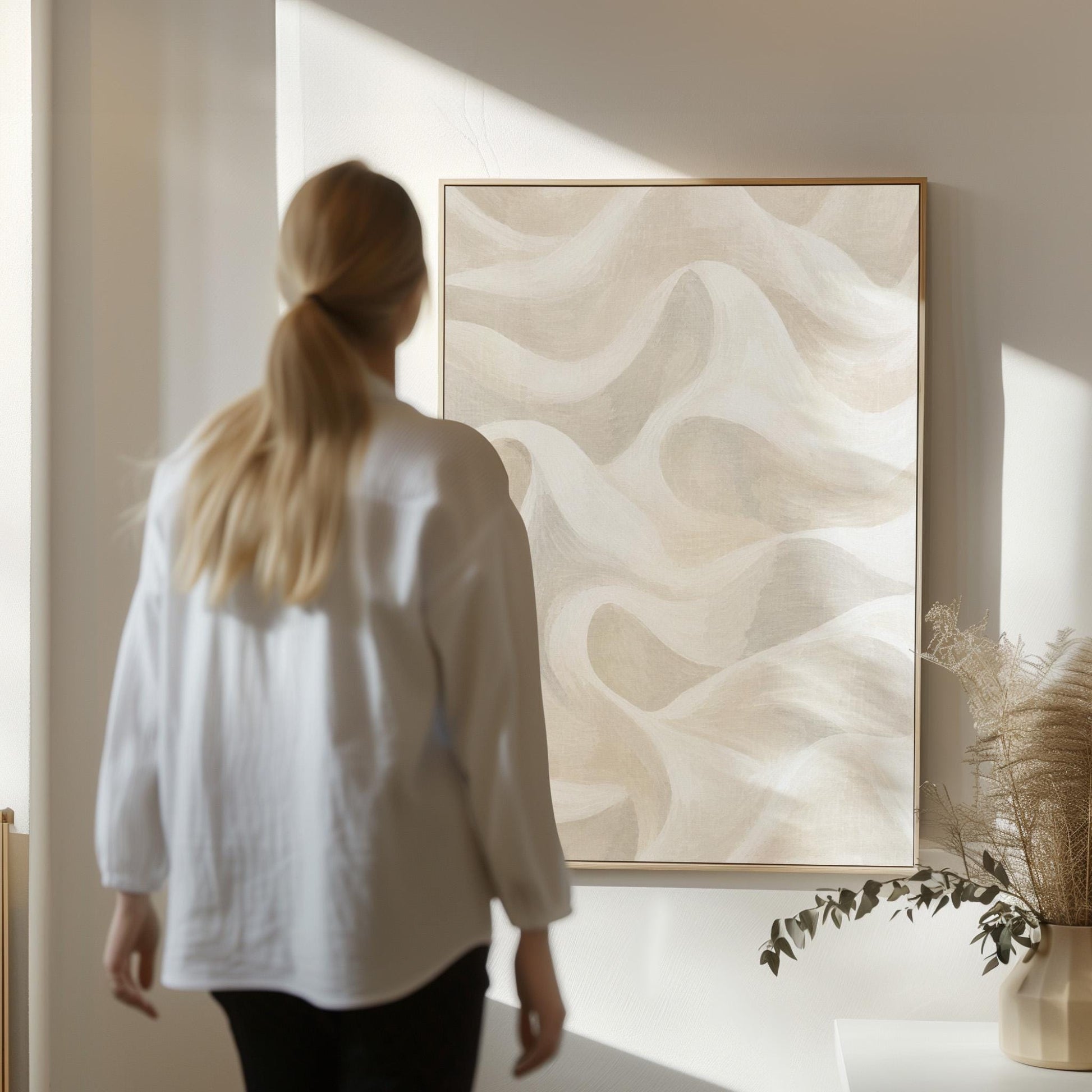 Flowing silky wave shapes in ivory and warm white, canvas print shown in a sunlit, contemporary room