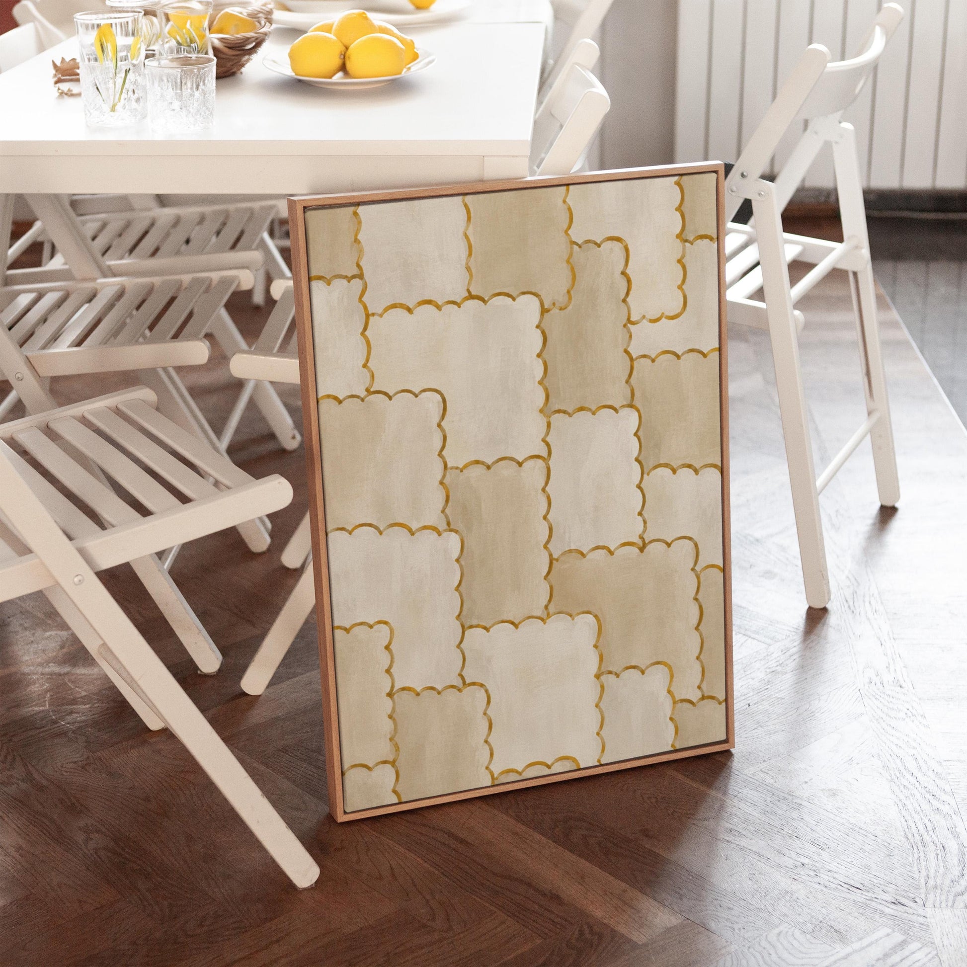 Overlapping tile pattern with scalloped gold edges in beige, canvas print seen in a warm interior with natural light