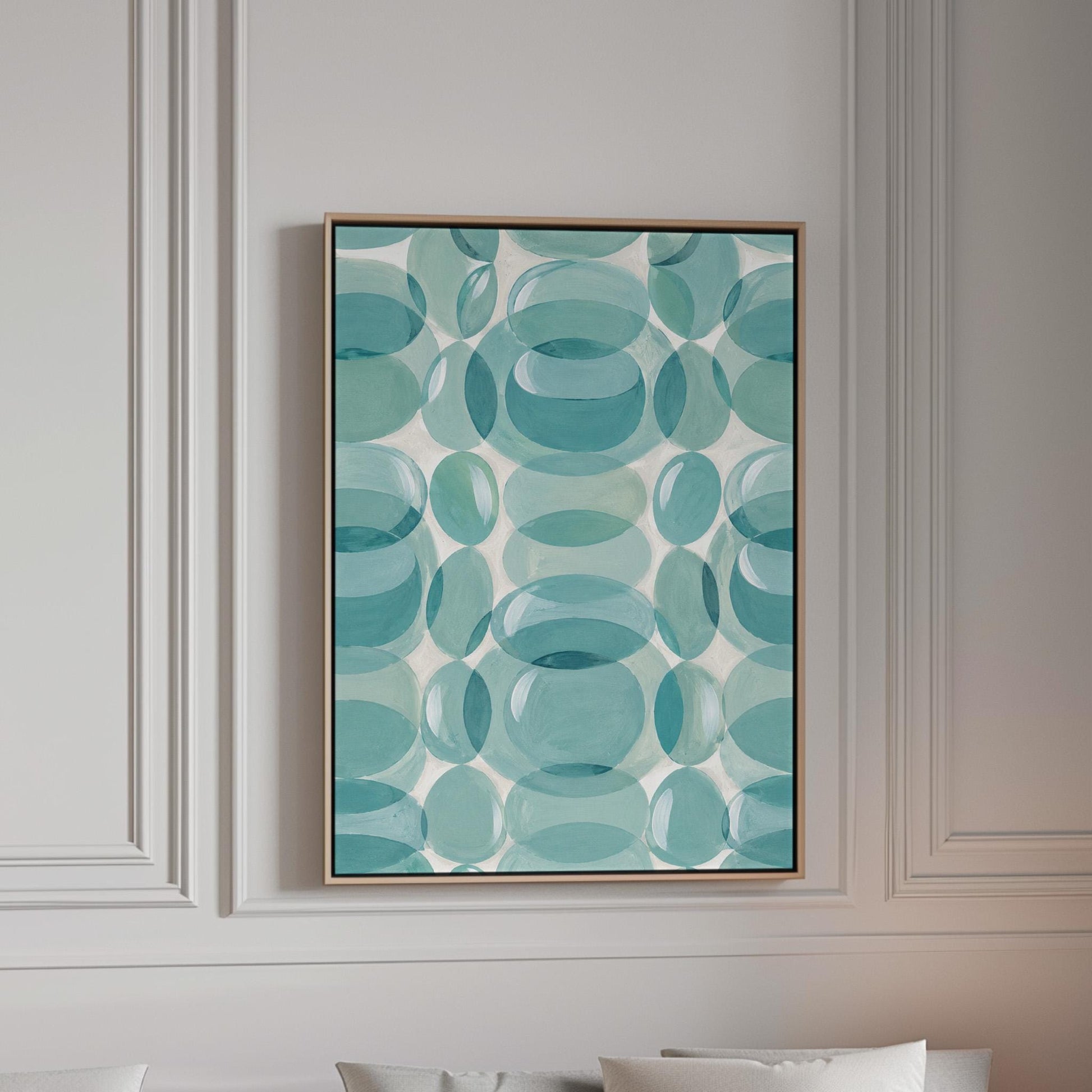 Overlapping translucent circles in teal and aqua tones, canvas print in a bright room with natural daylight