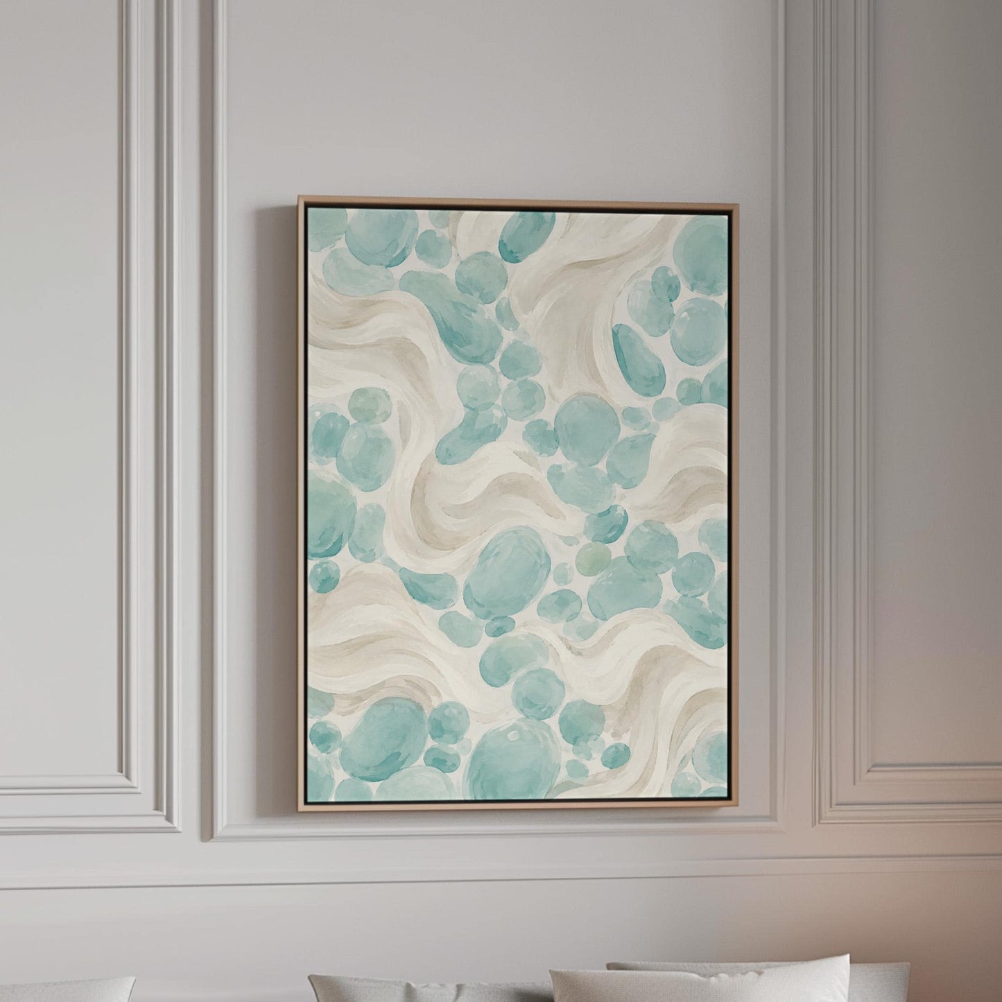 Aqua pebble shapes drifting among soft cream waves, canvas print in a bright room with natural daylight