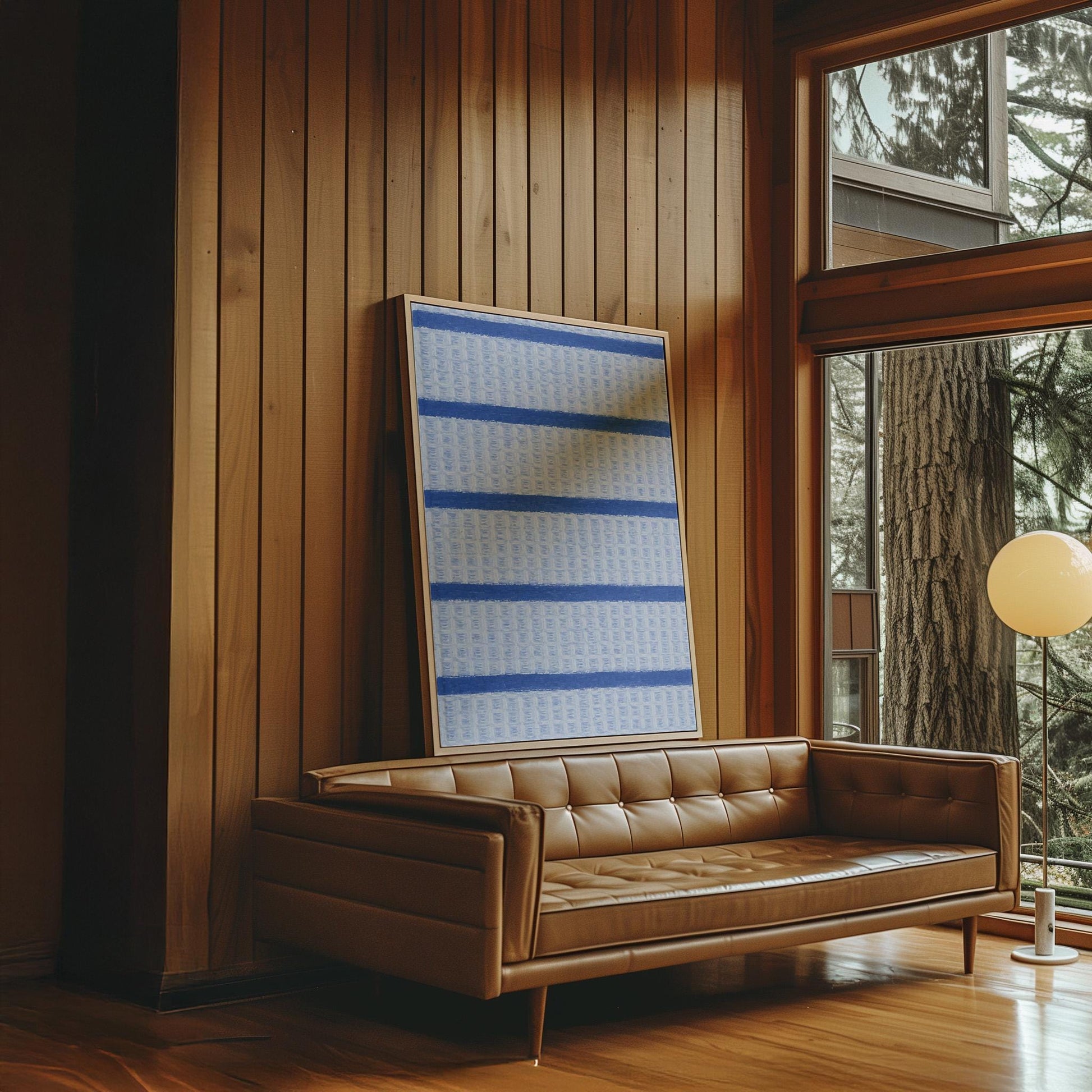 Bold cornflower blue stripes on a pale blue background, canvas print shown to scale in a furnished room