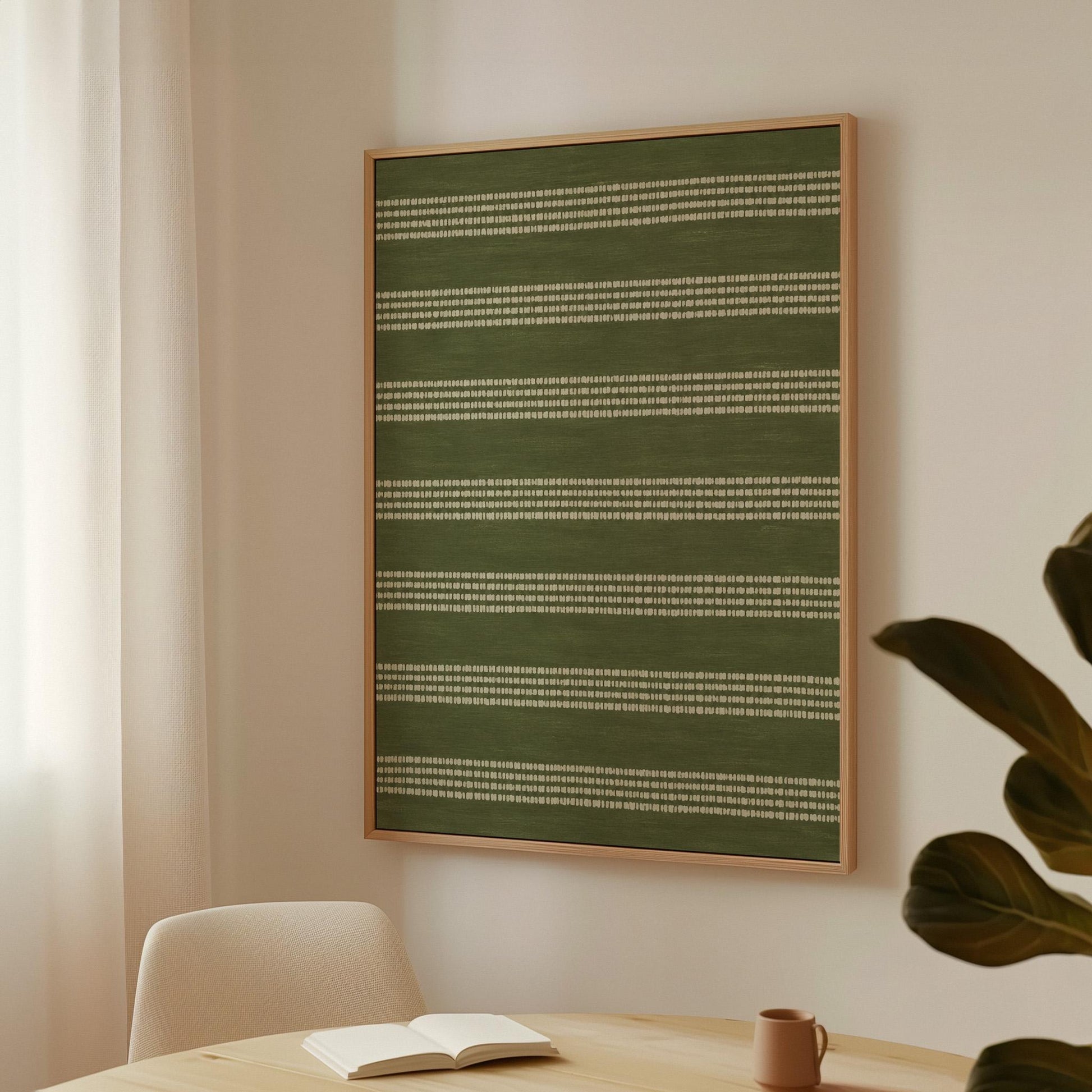 Olive green field with thin cream pinstripe rows, canvas print seen in a warm interior with natural light