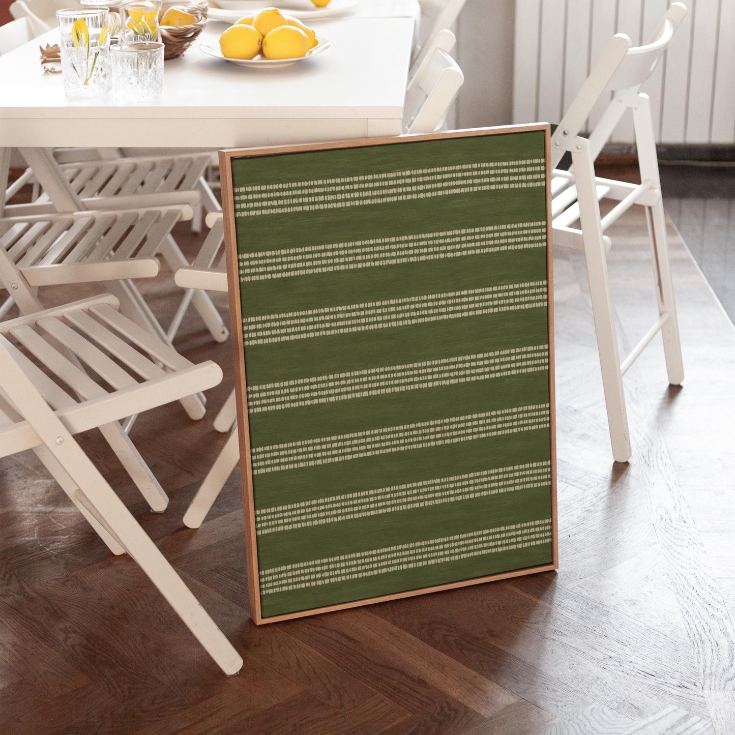 Olive green field with thin cream pinstripe rows, canvas print presented in a light, minimal room