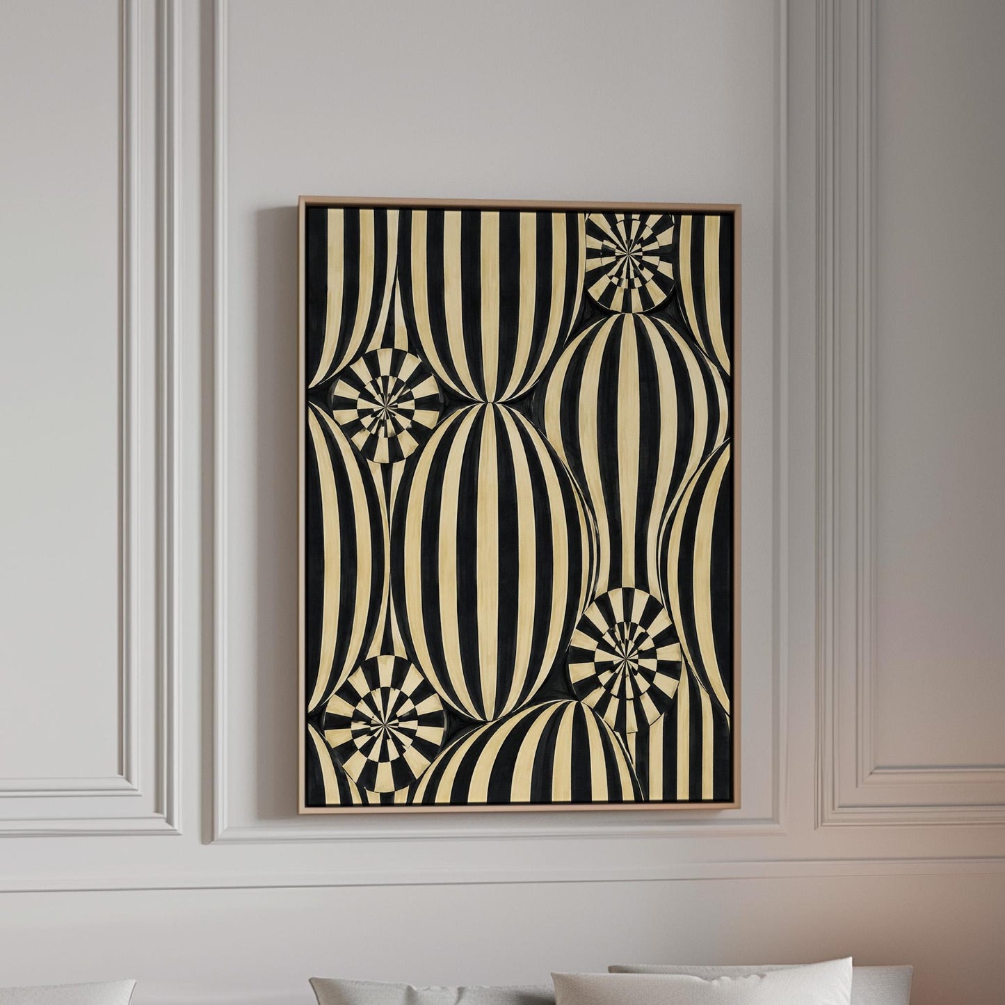 Optical illusion of striped spheres in black and cream, canvas print in a bright room with natural daylight