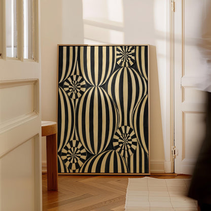 Optical illusion of striped spheres in black and cream, canvas print seen in a warm interior with natural light