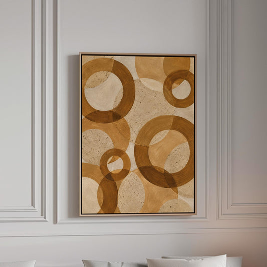 Overlapping translucent circles in amber and terracotta, canvas print in a bright room with natural daylight