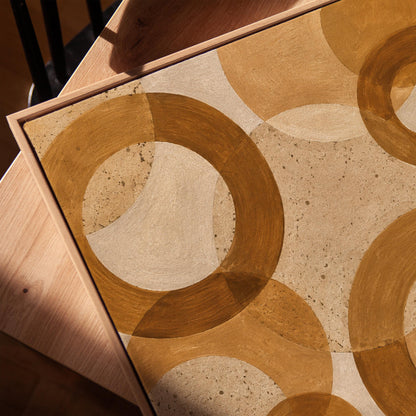 Overlapping translucent circles in amber and terracotta, canvas print in a warm, minimally styled interior