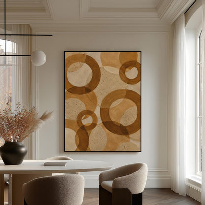 Overlapping translucent circles in amber and terracotta, canvas print displayed on a neutral wall in a styled interior
