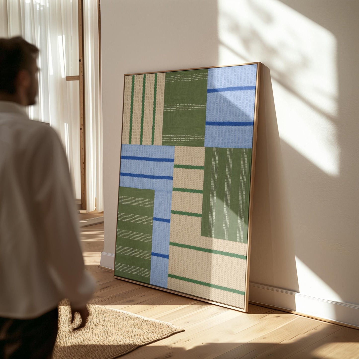 Patchwork of sage green fields with periwinkle blue bands, canvas print on a quiet wall in a considered interior