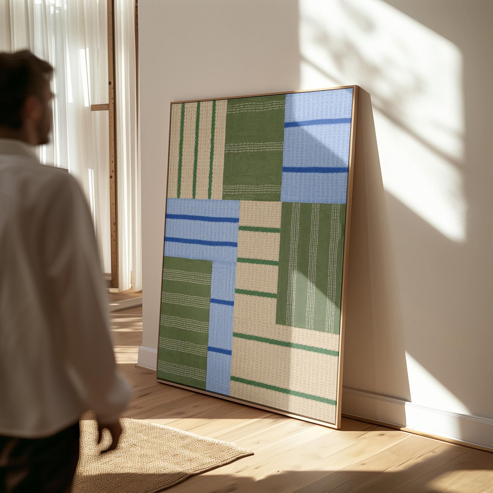 Patchwork of sage green fields with periwinkle blue bands, canvas print on a quiet wall in a considered interior