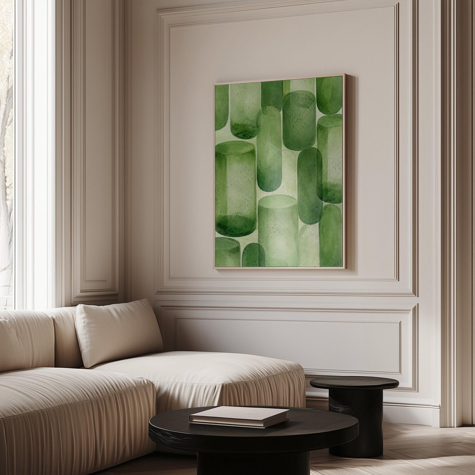 Rounded capsule shapes in layered watercolor greens, canvas print on a quiet wall in a considered interior