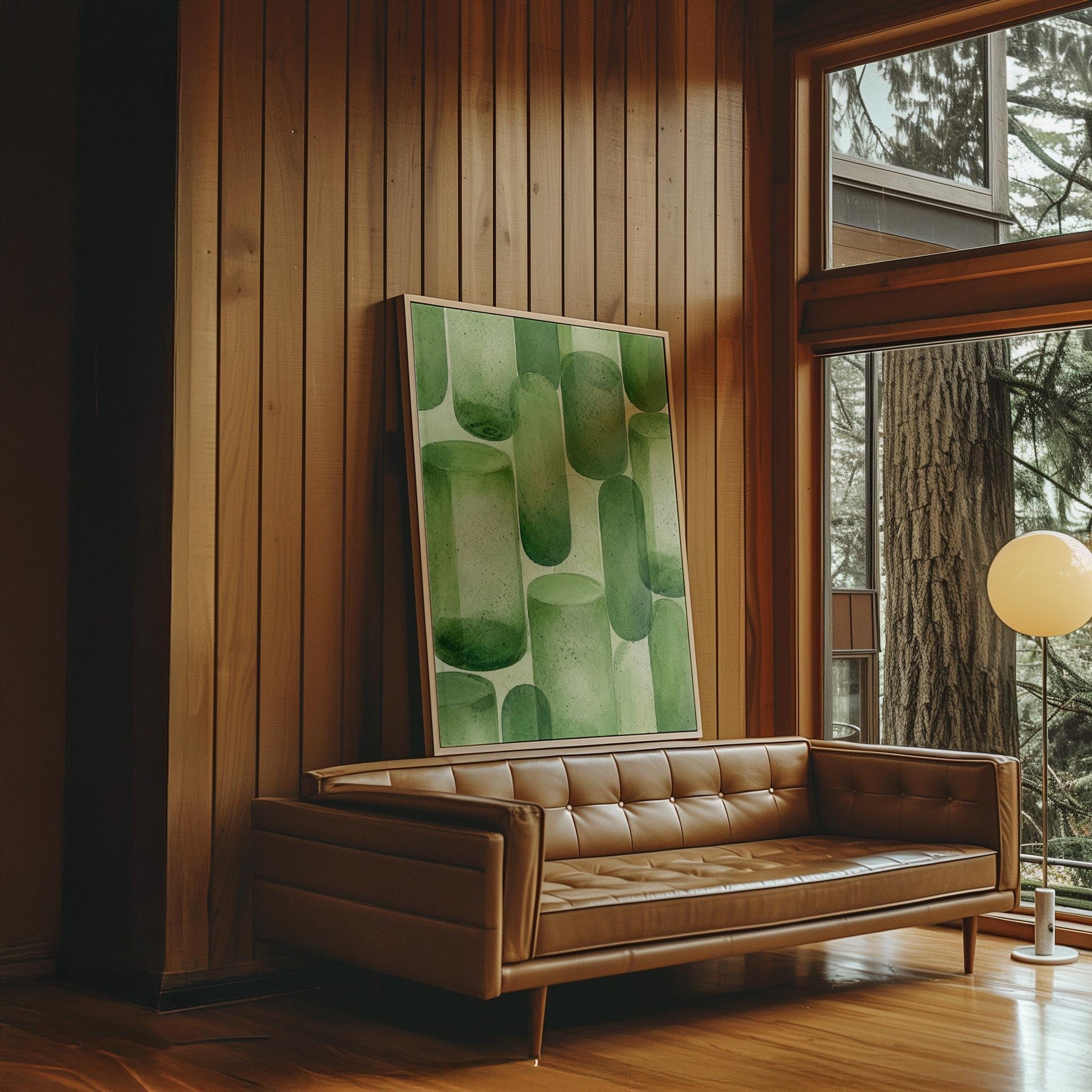 Rounded capsule shapes in layered watercolor greens, canvas print shown to scale in a furnished room