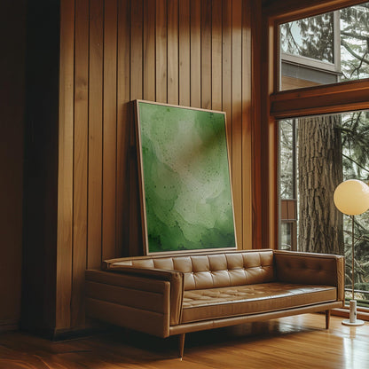 Loose watercolor wash in deep moss and forest greens, canvas print on a quiet wall in a considered interior