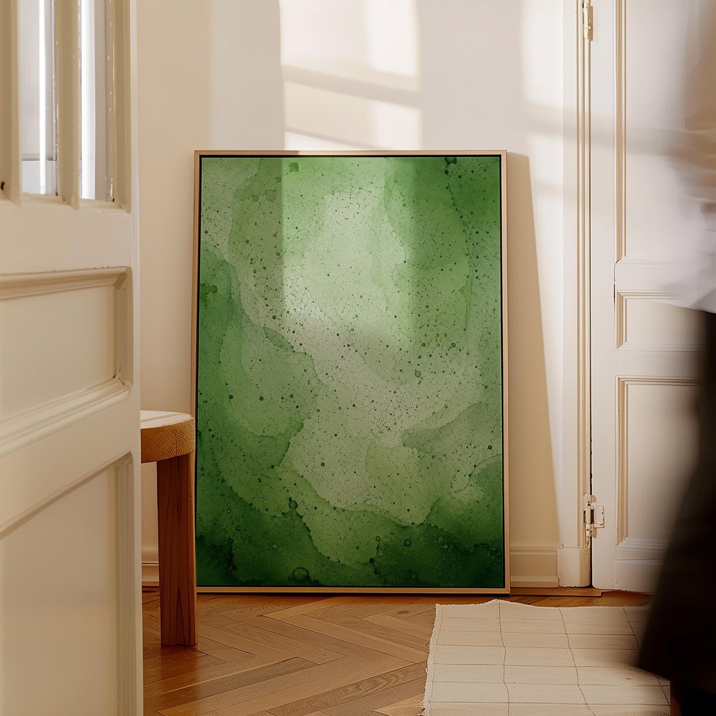 Loose watercolor wash in deep moss and forest greens, canvas print seen in a warm interior with natural light