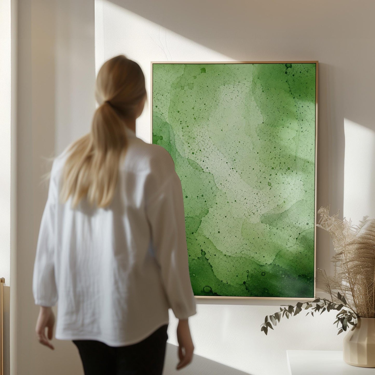 Loose watercolor wash in deep moss and forest greens, canvas wall art on a quiet wall in a considered interior