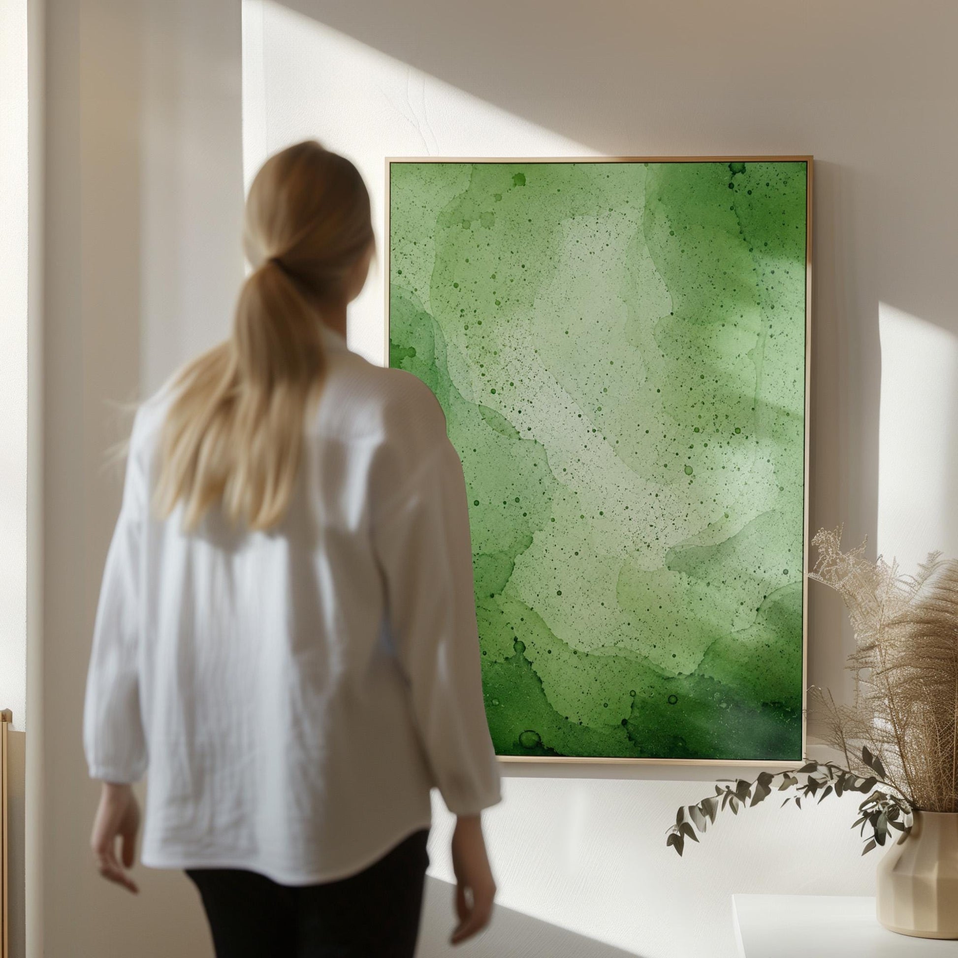 Loose watercolor wash in deep moss and forest greens, canvas wall art on a quiet wall in a considered interior