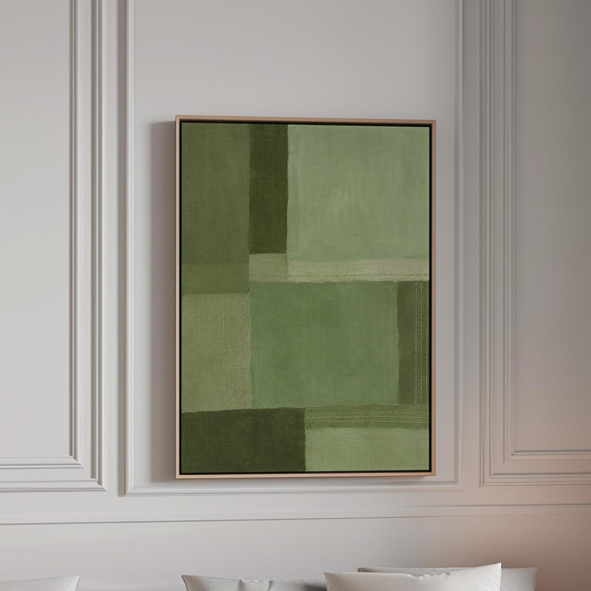Tonal color blocks in muted sage and olive green, canvas print in a bright room with natural daylight