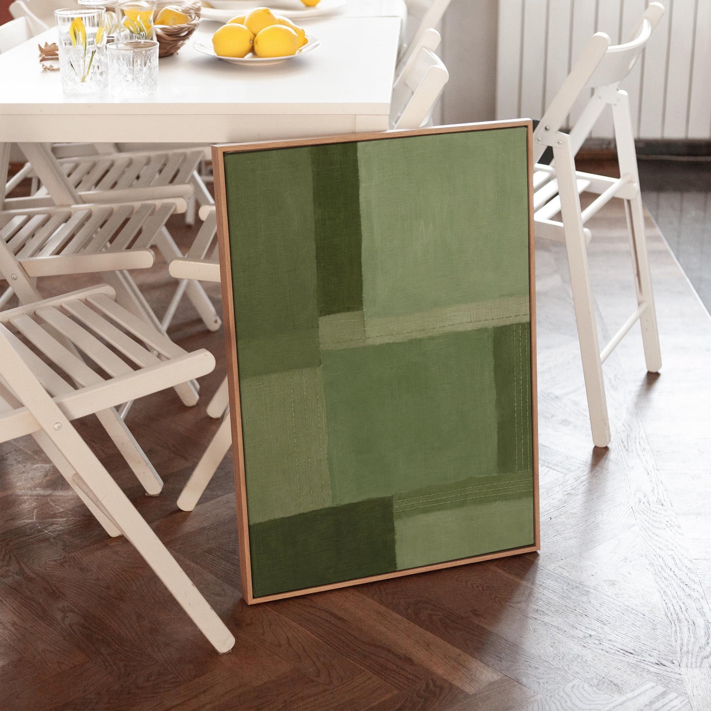 Tonal color blocks in muted sage and olive green, canvas print shown in a sunlit, contemporary room