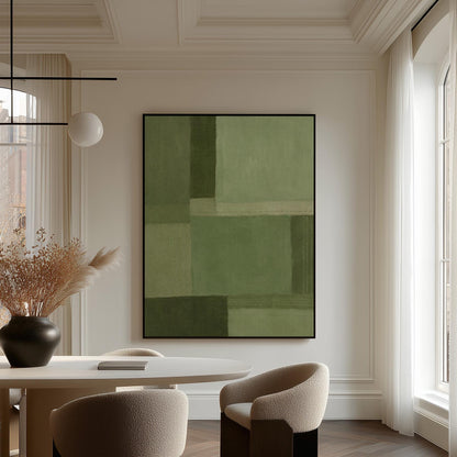 Tonal color blocks in muted sage and olive green, canvas wall art seen in a warm interior with natural light