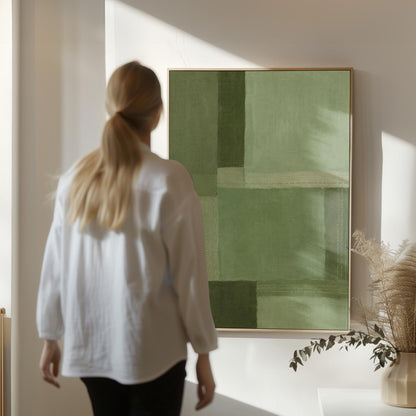 Tonal color blocks in muted sage and olive green, canvas wall art on a quiet wall in a considered interior
