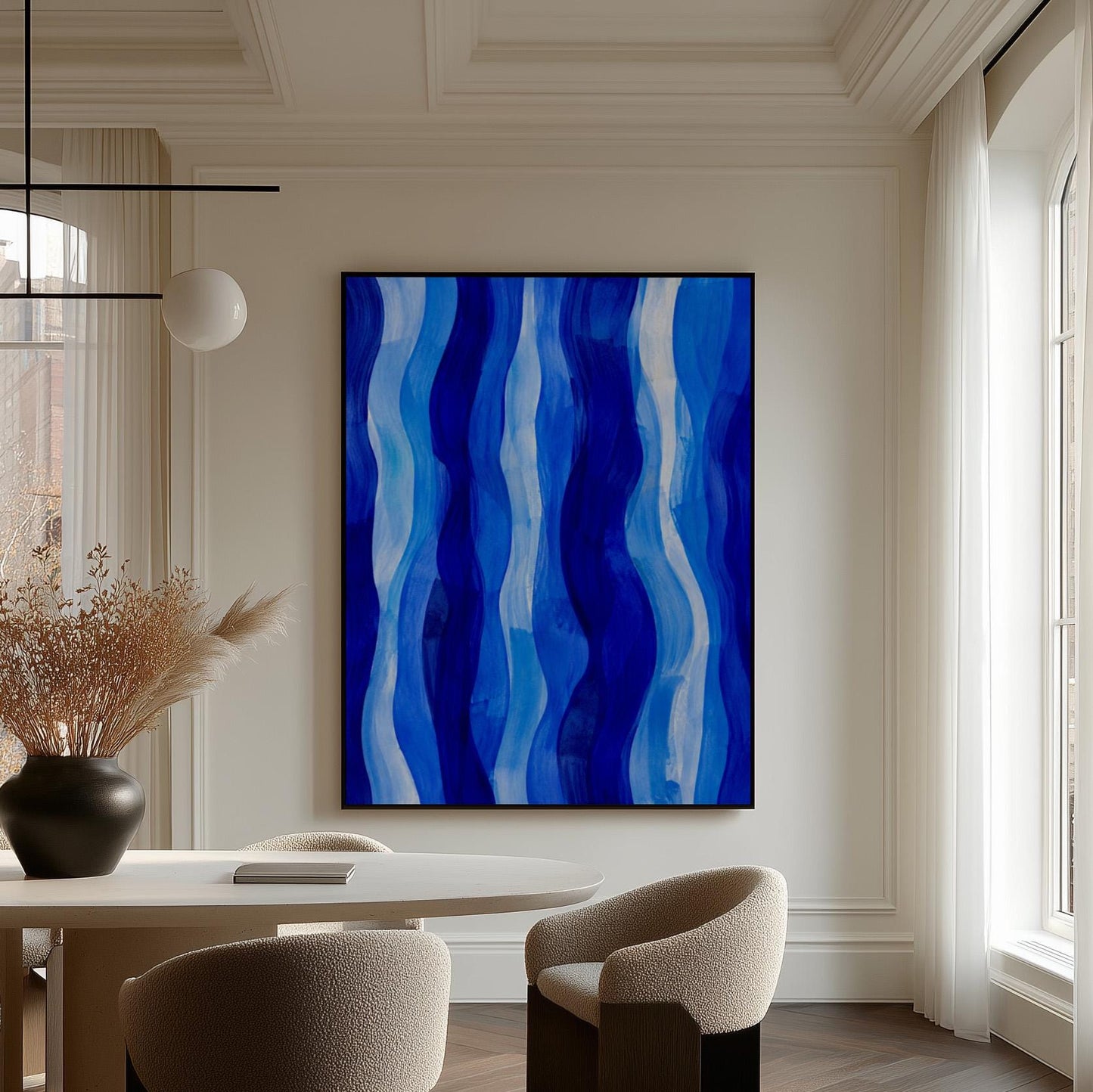Vertical flowing ribbons in cobalt and light blue, canvas print presented in a light, minimal room