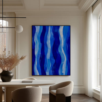 Vertical flowing ribbons in cobalt and light blue, canvas print presented in a light, minimal room